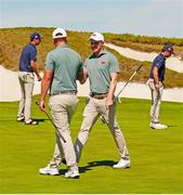 7 September 2025; Stuart Grehan of Great Britain and Ireland is congratulated by playing partner Eliot Baker after chipping the ball in from off the green on the 16th hole during day two of the 50th Walker Cup at Cypress Point Club in California, USA. Photo by Brian Spurlock/Sportsfile