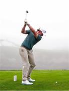 7 September 2025; Gavin Tiernan of Great Britain and Ireland plays his tee shot in the fog on the 16th hole during the afternoon singles matches of day two of the 50th Walker Cup at Cypress Point Club in California, USA. Photo by Brian Spurlock/Sportsfile