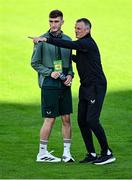 9 September 2025; Republic of Ireland manager Jim Crawford, right, in conversation with Mason Melia of Republic of Ireland before the UEFA European U21 Championship qualifying match between Republic of Ireland and Andorra at Tallaght Stadium in Dublin. Photo by Ramsey Cardy/Sportsfile