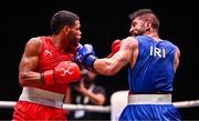 10 September 2025; Erislandy Alvarez Borges of Cuba, left, in action against Ali Habibnezhad of Iran during their Men's 65kg quarterfinal bout during the World Boxing Championships 2025 at M&S Bank Arena in Liverpool, England. Photo by Ben McShane/Sportsfile