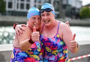 13 September 2025; The winner Liz Keary, left, celebrates with her club mate from Ocean Breakers Monica Devine, who finished 3rd, after the The 105th Dublin City Liffey Swim on Dublin's River Liffey. Photo by Ray McManus/Sportsfile