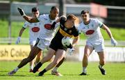 14 September 2025; Cian McMahon of Dr Crokes in action against Stefan Okunbor and Oisin Maunsell of Na Gaeil during the Kerry County Senior Club Football Championship final match between Dr Crokes and Na Gaeil at Austin Stack Park in Tralee, Kerry. Photo by Brendan Moran/Sportsfile