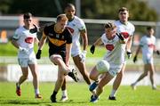 14 September 2025; Cian McMahon of Dr Crokes in action against Stefan Okunbor and Tomas O'Hainifein of Na Gaeil during the Kerry County Senior Club Football Championship final match between Dr Crokes and Na Gaeil at Austin Stack Park in Tralee, Kerry. Photo by Brendan Moran/Sportsfile