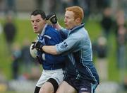 10 October 2004; Alan Carty, Skryne, is tackled by Shane Leddy, Simonstown Gaels. Meath Senior Football Final, Simonstown Gaels v Skryne, Pairc Tailteann, Navan, Co. Meath. Picture credit; Pat Murphy / SPORTSFILE
