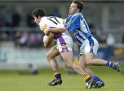 10 October 2004; Fionnan Kennedy, Kilmacud Crokes, is tackled by Andrew Kerin, Ballyboden St. Endas. Dublin Senior Football Final, Kilmacud Crokes v Ballyboden St. Endas, Parnell Park, Dublin. Picture credit; David Maher / SPORTSFILE
