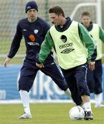 11 October 2004; Robbie Keane, Republic of Ireland, in action against team-mate Gary Breen during squad training. Malahide FC, Malahide, Co. Dublin. Picture credit; David Maher / SPORTSFILE