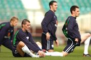 12 October 2004; Roy Keane, Republic of Ireland, stretches with team-mates, left to right, Damien Duff, John O'Shea and Steve Finnan during squad training. Lansdowne Road, Dublin. Picture credit; David Maher / SPORTSFILE