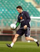 12 October 2004; Robbie Keane, Republic of Ireland, practices his gaelic football skills during squad training. Lansdowne Road, Dublin. Picture credit; David Maher / SPORTSFILE