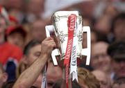 12 September 2004; The Liam MacCarthy cup is held aloft by Cork captain Ben O'Connor after victory over Kilkenny. Guinness All-Ireland Senior Hurling Championship Final, Cork v Kilkenny, Croke Park, Dublin. Picture credit; Damien Eagers / SPORTSFILE *** Local Caption *** Any photograph taken by SPORTSFILE during, or in connection with, the 2004 Guinness All-Ireland Hurling Final which displays GAA logos or contains an image or part of an image of any GAA intellectual property, or, which contains images of a GAA player/players in their playing uniforms, may only be used for editorial and non-advertising purposes.  Use of photographs for advertising, as posters or for purchase separately is strictly prohibited unless prior written approval has been obtained from the Gaelic Athletic Association.