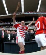 12 September 2004; Cork goalkeeper Donal Og Cusack celebrates after victory over Kilkenny. Guinness All-Ireland Senior Hurling Championship Final, Cork v Kilkenny, Croke Park, Dublin. Picture credit; Brendan Moran / SPORTSFILE *** Local Caption *** Any photograph taken by SPORTSFILE during, or in connection with, the 2004 Guinness All-Ireland Hurling Final which displays GAA logos or contains an image or part of an image of any GAA intellectual property, or, which contains images of a GAA player/players in their playing uniforms, may only be used for editorial and non-advertising purposes.  Use of photographs for advertising, as posters or for purchase separately is strictly prohibited unless prior written approval has been obtained from the Gaelic Athletic Association.