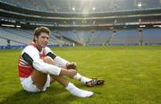 15 October 2004; Setanta O'hAilpin puts on his boots before Ireland International Rules team training. Croke Park, Dublin. Picture credit; Damien Eagers / SPORTSFILE