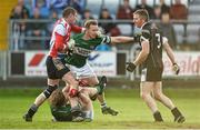 20 October 2013; Michael Leigh, left, and Paul McDonald, Arles - Killeen, during an altercation with Paul Cahillane, centre, and Cahir Healy, bottom, Portlaoise. Laois County Senior Club Football Championship Final, Portlaoise v Arles - Killeen, O'Moore Park, Portlaoise, Co. Laois. Picture credit: Barry Cregg / SPORTSFILE