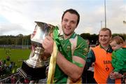 20 October 2013; Michael Murphy, Glenswilly, celebrates with the cup and manager Gary McDaid at the end of the game. Donegal County Senior Club Football Championship Final, Glenswilly v Killybegs, MacCumhaill Park, Ballybofey, Co. Donegal. Picture credit: David Maher / SPORTSFILE
