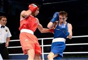 21 October 2013; Michael Conlan, St. John Bosco BC, Belfast, representing Ireland, right, exchanges punches with Brian Gonzalez, Mexico, during their Men's Bantamweight 56Kg Last 16 bout. AIBA World Boxing Championships Almaty 2013, Almaty, Kazakhstan. Photo by Sportsfile