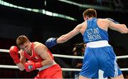 21 October 2013; Aston Brown, Scotland, right, exchanges punches with Jason Quigley, Finn Valley BC, Donegal, representing Ireland, during their Men's Middleweight 75Kg Last 16 bout. AIBA World Boxing Championships Almaty 2013, Almaty, Kazakhstan. Photo by Sportsfile