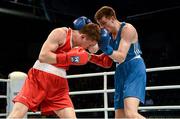 21 October 2013; Jason Quigley, left, Finn Valley BC, Donegal, representing Ireland, exchanges punches with Aston Brown, Scotland, during their Men's Middleweight 75Kg Last 16 bout. AIBA World Boxing Championships Almaty 2013, Almaty, Kazakhstan. Photo by Sportsfile