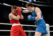 21 October 2013; Aston Brown, right, Scotland, exchanges punches with Jason Quigley, Finn Valley BC, Donegal, representing Ireland, during their Men's Middleweight 75Kg Last 16 bout. AIBA World Boxing Championships Almaty 2013, Almaty, Kazakhstan. Photo by Sportsfile