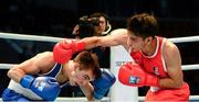21 October 2013; Brian Gonzalez, right, Mexico, exchanges punches with Michael Conlan, St. John Bosco BC, Belfast, representing Ireland, during their Men's Bantamweight 56Kg Last 16 bout. AIBA World Boxing Championships Almaty 2013, Almaty, Kazakhstan. Photo by Sportsfile