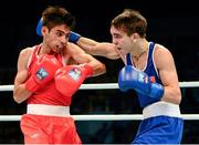21 October 2013; Michael Conlan, right, St. John Bosco BC, Belfast, representing Ireland, exchanges punches with Brian Gonzalez, Mexico, during their Men's Bantamweight 56Kg Last 16 bout. AIBA World Boxing Championships Almaty 2013, Almaty, Kazakhstan. Photo by Sportsfile