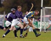 16 October 2004; Darren McCormack, Ireland, in action against Lachlann Campbell and Chris Bamber (10), Scotland. Senior Mens Hurling Shinty International, Ireland v Scotland, Rathoath GAA Club, Phairc Sean Eiffe, Co. Meath. Picture credit; Damien Eagers / SPORTSFILE