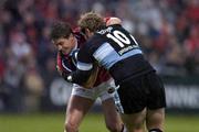 16 October 2004; Ronan O'Gara, Munster, in action against Lee Thomas, Cardiff Blues. Celtic League 2004-2005, Munster v Cardiff Blues, Thomond Park, Limerick. Picture credit; Brendan Moran / SPORTSFILE