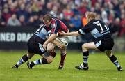16 October 2004; Anthony Horgan, Munster, in action against Martin Jones and Martyn Williams (7), Cardiff Blues. Celtic League 2004-2005, Munster v Cardiff Blues, Thomond Park, Limerick. Picture credit; Brendan Moran / SPORTSFILE