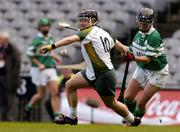 17 October 2004; Marie Keating, Ireland, in action against Anne Marie O'Dwyer, Britain. 2004 Coca Cola International Camogie Competition Final, Ireland v Britain, Croke Park, Dublin. Picture credit; Brian Lawless / SPORTSFILE