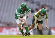 17 October 2004; Therese Maher, right, Ireland, in action against Aileen Donnelly, Britain. 2004 Coca Cola International Camogie Competition Final, Ireland v Britain, Croke Park, Dublin. Picture credit; Brendan Moran / SPORTSFILE