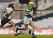 17 October 2004; Suzanne Keatley, Britain, in action against Gemma Kelly, Ireland. 2004 Coca Cola International Camogie Competition Final, Ireland v Britain, Croke Park, Dublin. Picture credit; Brian Lawless / SPORTSFILE
