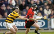 17 October 2004; Darren Stamp, Oulart-the-Ballagh, is tackled by John O'Connor, Rathnure. Wexford Senior Hurling Final, Rathnure v Oulart-the-Ballagh, Wexford Park, Co. Wexford. Picture credit; Matt Browne / SPORTSFILE