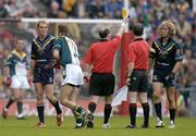 17 October 2004; Mark McVeigh, Australia, is shown a yellow card by referee Stephen McBurney and subsequently sin-binned. Coca Cola International Rules Series 2004, First Test, Ireland v Australia, Croke Park, Dublin. Picture credit; Brendan Moran / SPORTSFILE *** Local Caption *** Any photograph taken by SPORTSFILE during, or in connection with, the 2004 Coca Cola International Rules Series which displays GAA logos or contains an image or part of an image of any GAA intellectual property, or, which contains images of a GAA player/players in their playing uniforms, may only be used for editorial and non-advertising purposes.  Use of photographs for advertising, as posters or for purchase separately is strictly prohibited unless prior written approval has been obtained from the Gaelic Athletic Association.