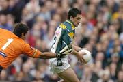 17 October 2004; Paul Galvin, Ireland, in action against Mal Michaels, Australia. Coca Cola International Rules Series 2004, First Test, Ireland v Australia, Croke Park, Dublin. Picture credit; Brendan Moran / SPORTSFILE *** Local Caption *** Any photograph taken by SPORTSFILE during, or in connection with, the 2004 Coca Cola International Rules Series which displays GAA logos or contains an image or part of an image of any GAA intellectual property, or, which contains images of a GAA player/players in their playing uniforms, may only be used for editorial and non-advertising purposes.  Use of photographs for advertising, as posters or for purchase separately is strictly prohibited unless prior written approval has been obtained from the Gaelic Athletic Association.