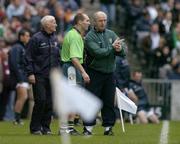 17 October 2004; Ireland assistant coach Larry Tompkins, right, has a word with team runner Mickey Linden. Coca Cola International Rules Series 2004, First Test, Ireland v Australia, Croke Park, Dublin. Picture credit; Brendan Moran / SPORTSFILE *** Local Caption *** Any photograph taken by SPORTSFILE during, or in connection with, the 2004 Coca Cola International Rules Series which displays GAA logos or contains an image or part of an image of any GAA intellectual property, or, which contains images of a GAA player/players in their playing uniforms, may only be used for editorial and non-advertising purposes.  Use of photographs for advertising, as posters or for purchase separately is strictly prohibited unless prior written approval has been obtained from the Gaelic Athletic Association.