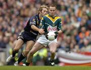 17 October 2004; Brendan Coulter, Ireland, in action against Mark McVeigh, Australia. Coca Cola International Rules Series 2004, First Test, Ireland v Australia, Croke Park, Dublin. Picture credit; Brendan Moran / SPORTSFILE *** Local Caption *** Any photograph taken by SPORTSFILE during, or in connection with, the 2004 Coca Cola International Rules Series which displays GAA logos or contains an image or part of an image of any GAA intellectual property, or, which contains images of a GAA player/players in their playing uniforms, may only be used for editorial and non-advertising purposes.  Use of photographs for advertising, as posters or for purchase separately is strictly prohibited unless prior written approval has been obtained from the Gaelic Athletic Association.
