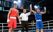 22 October 2013; Sean McComb, left, Holy Trinity BC, Belfast, representing Ireland, after losing to Elvin Isayev, Azerbaijan, in their Men's Lightweight 60Kg Last 16 bout. AIBA World Boxing Championships Almaty 2013, Almaty, Kazakhstan. Photo by Sportsfile