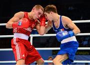 23 October 2013; Michael Conlan, right, St. John Bosco BC, Belfast, representing Ireland, exchanges punches with Vladimir Nikitin, Russia, during their Men's Bantamweight 56Kg Quarter-Final bout. AIBA World Boxing Championships Almaty 2013, Almaty, Kazakhstan. Photo by Sportsfile