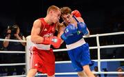 23 October 2013; Vladimir Nikitin, left, Russia, exchanges punches with Michael Conlan, St. John Bosco BC, Belfast, representing Ireland, during their Men's Bantamweight 56Kg Quarter-Final bout. AIBA World Boxing Championships Almaty 2013, Almaty, Kazakhstan. Photo by Sportsfile