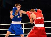 23 October 2013; Vladimir Nikitin, left, Russia, exchanges punches with Michael Conlan, St. John Bosco BC, Belfast, representing Ireland, during their Men's Bantamweight 56Kg Quarter-Final bout. AIBA World Boxing Championships Almaty 2013, Almaty, Kazakhstan. Photo by Sportsfile