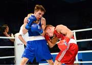 23 October 2013; Vladimir Nikitin, right, Russia, exchanges punches with Michael Conlan, St. John Bosco BC, Belfast, representing Ireland, during their Men's Bantamweight 56Kg Quarter-Final bout. AIBA World Boxing Championships Almaty 2013, Almaty, Kazakhstan. Photo by Sportsfile