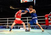 23 October 2013; Paddy Barnes, left, Holy Family BC, Belfast, representing, Ireland, exchanges punches with Jasurbek Latipov, Uzbekistan, during their Men's Flyweight 52Kg Quarter-Final bout. AIBA World Boxing Championships Almaty 2013, Almaty, Kazakhstan. Photo by Sportsfile