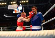 23 October 2013; Paddy Barnes, left, Holy Family BC, Belfast, representing, Ireland, exchanges punches with Jasurbek Latipov, Uzbekistan, during their Men's Flyweight 52Kg Quarter-Final bout. AIBA World Boxing Championships Almaty 2013, Almaty, Kazakhstan. Photo by Sportsfile