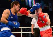 23 October 2013; Paddy Barnes, right, Holy Family BC, Belfast, representing, Ireland, exchanges punches with Jasurbek Latipov, Uzbekistan, during their Men's Flyweight 52Kg Quarter-Final bout. AIBA World Boxing Championships Almaty 2013, Almaty, Kazakhstan. Photo by Sportsfile