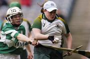17 October 2004; Aoife Murray, Ireland goalkeeper, in action against Edel Murphy, Britain. 2004 Coca Cola International Camogie Competition Final, Ireland v Britain, Croke Park, Dublin. Picture credit; Brian Lawless / SPORTSFILE