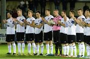 25 October 2013; Dundalk players hold a minute applause for the late Dundalk FC legend Tommy McConville. Airtricity League Premier Division, Bray Wanderers v Dundalk, Carlisle Grounds, Bray, Co. Wicklow. Picture credit: Ramsey Cardy / SPORTSFILE