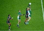 26 October 2013; Zach Tuohy, right, Ireland, and team-mate John Doyle go for a high ball ahead of Daniel Wells, and Aaron Davey, left, Australia. International Rules Second Test, Ireland v Australia, Croke Park, Dublin. Picture credit: Ray McManus / SPORTSFILE