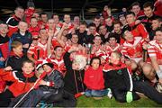 27 October 2013; Loughgiel Shamrocks, with the cup after the match. AIB Ulster Senior Club Hurling Championship Final, Loughgiel Shamrocks v Slaughneil, Celtic Park, Derry. Picture credit: Ramsey Cardy / SPORTSFILE