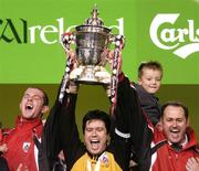 24 October 2004; Stand in captain Stephen O'Brien, centre, with suspended captain Barry Ferguson, left and manager Alan Mathews, Longford Town, lift the FAI Carlsberg Cup at the end of the game after victory over  Waterford United. 2004 FAI Carlsberg Cup Final, Longford Town v Waterford United, Lansdowne Road, Dublin. Picture credit; David Maher / SPORTSFILE
