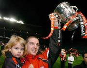24 October 2004; Barry Ferguson, Longford Town suspended captain, celebrates with daughter Elle at the end of the game after victory over Waterford United. 2004 FAI Carlsberg Cup Final, Longford Town v Waterford United, Lansdowne Road, Dublin. Picture credit; David Maher / SPORTSFILE