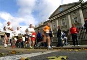 25 October 2004; Runners pass Trinity College during the closing stages of the race. adidas Dublin City Marathon 2004, Merrion Square, Dublin. Picture credit; Pat Murphy / SPORTSFILE