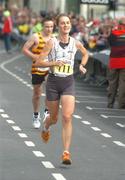 25 October 2004; Irish National Women's Champion and first woman home Valerie Vaughan crosses the line. adidas Dublin City Marathon 2004. Merrion Square, Dublin. Picture credit; Pat Murphy / SPORTSFILE